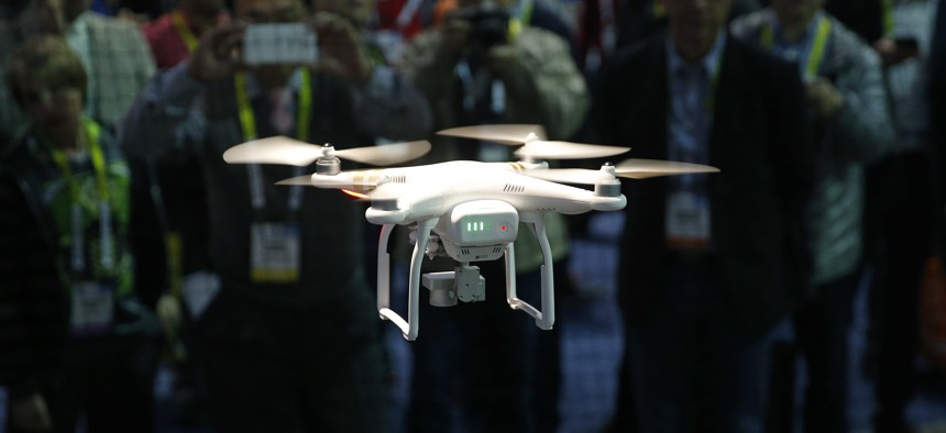 In this Jan. 7, 2016, file photo, a drone hovers at a booth during CES International, Thursday, Jan. 7, 2016, in Las Vegas. 