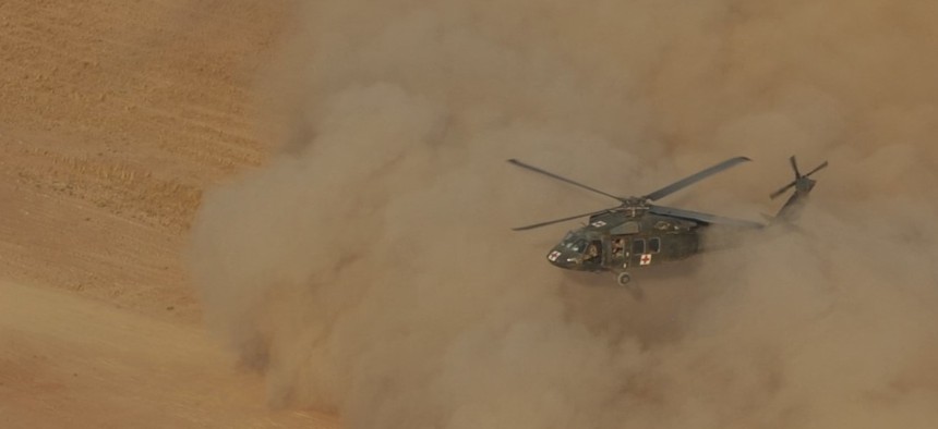 A U.S. Army UH-60 Black Hawk medevac helicopter conducts a limited visibility, or brownout, landing during medevac training in northern Iraq on July 3, 2016. 