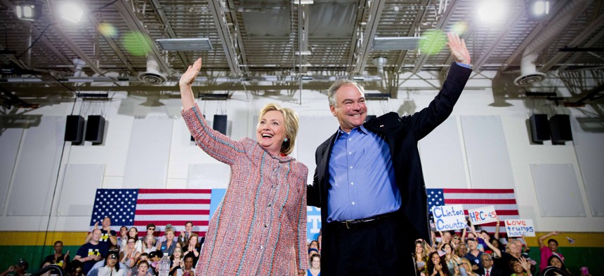 Democratic presidential candidate Hillary Clinton, and Sen. Tim Kaine, D-Va., participate in a rally at Northern Virginia Community College in Annandale, Va., Thursday, July 14, 2016.