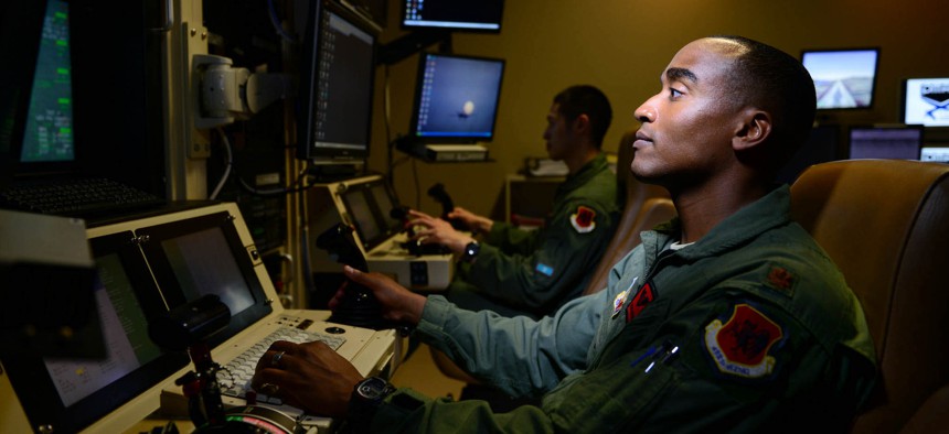 Maj. Bishane, a 432nd Aircraft Maintenance Squadron MQ-9 Reaper pilot, remotely controls an aircraft from Creech Air Force Base, Nev. 