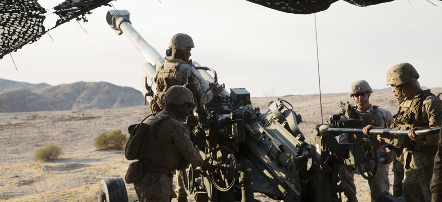 Marines prepare to fire an M777A2 howitzer during an excercise at the at Marine Corps Air-Ground Combat Center Twentynine Palms, Calif., Aug. 16, 2016.