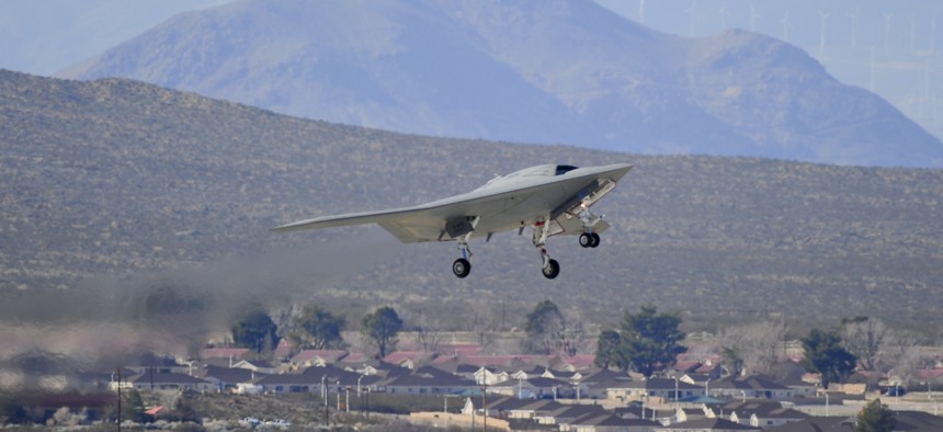 An X-47B Unmanned Combat Air System Demonstrator (UCAS-D) completes its first flight at Edwards Air Force Base, Calif., Feb. 4, 2011.