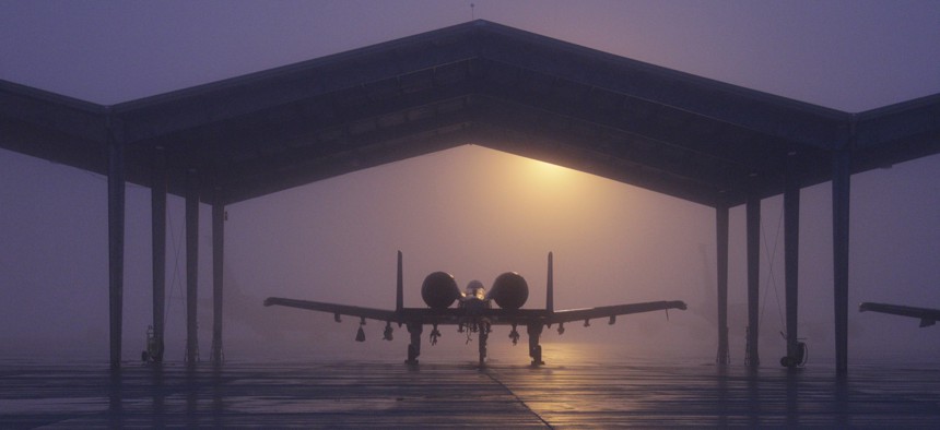 An A-10 Thunderbolt II from the 127th Wing is parked beneath a shelter on a foggy morning Jan. 11, 2014, at Selfridge Air National Guard Base, Mich