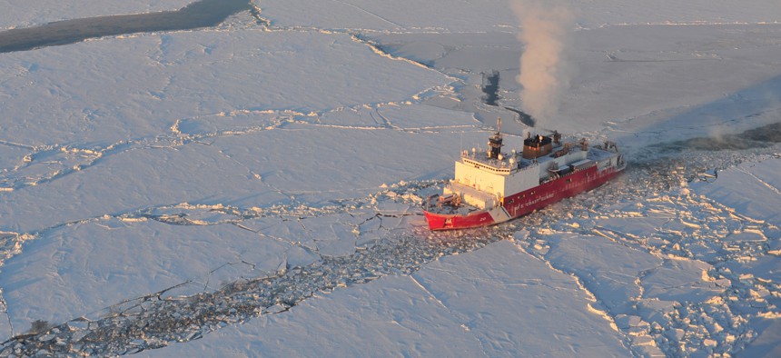 In this 2006 file photo, the U.S. Coast Guard cutter Healy breaks ice for the Russian tanker Renda near Nome, Alaska.