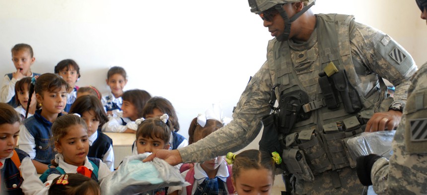 The U.S. Army 4th Battalion, 64th Armor Regiment, distributed backpacks to Iraqi children in a 2008 deployment.