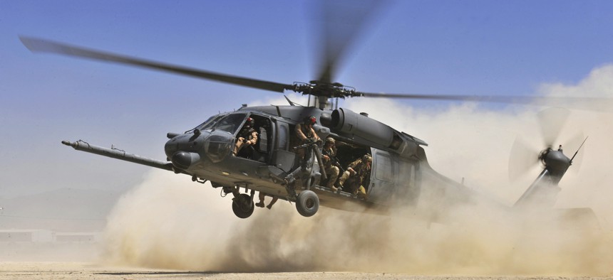 A U.S. Air Force HH-60G Pave Hawk helicopter carrying combat search and rescue Airmen approaches a landing zone during an exercise Aug. 21, 2010, at Bagram Airfield, Afghanistan. 