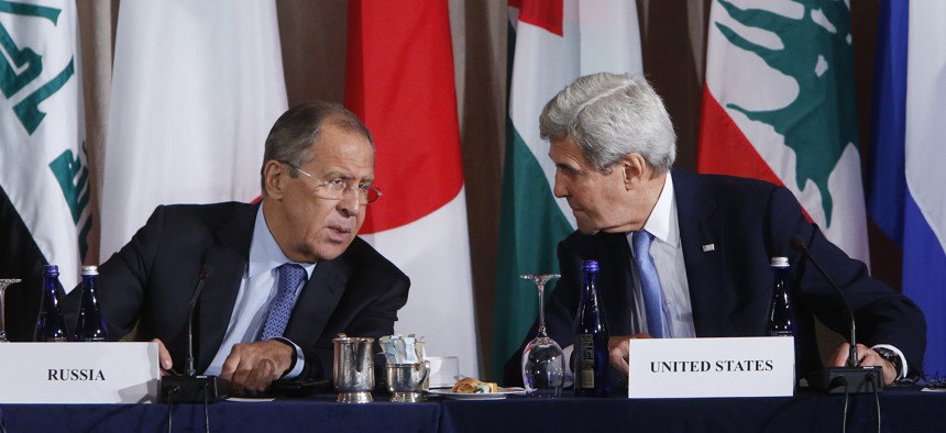 Russia's Foreign Minister Sergey Lavrov, left, and United States Secretary of State John Kerry talk during a meeting of the International Syria Support Group, Sept. 22, 2016, in New York.