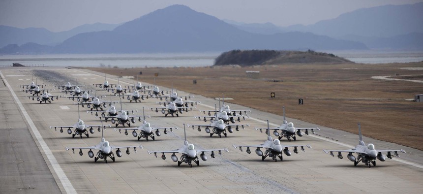 F-16 Fighting Falcons demonstrate an "elephant walk" formation as they taxi down a runway during an exercise at Kunsan Air Base, South Korea, on Dec. 2, 2011. 