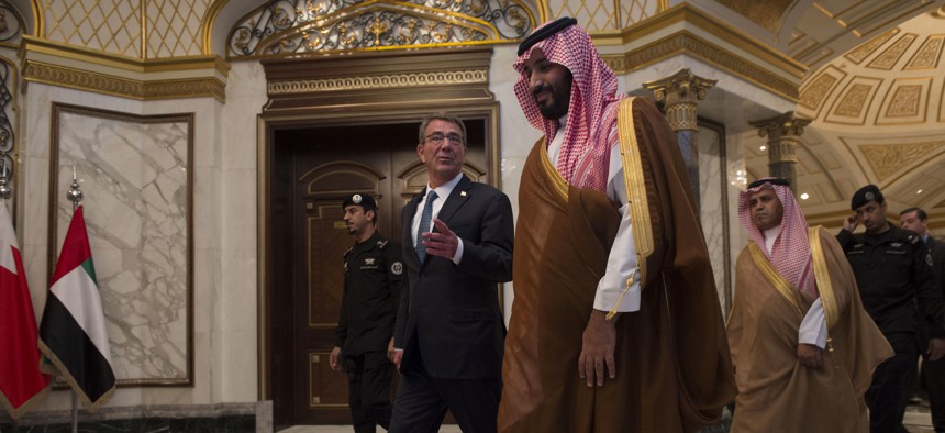 Defense Secretary Ash Carter walks and talks with Saudi Arabia's Deputy Crown Prince and Minister of Defense Mohammed bin Salman in Saudi Arabia earlier this year.
