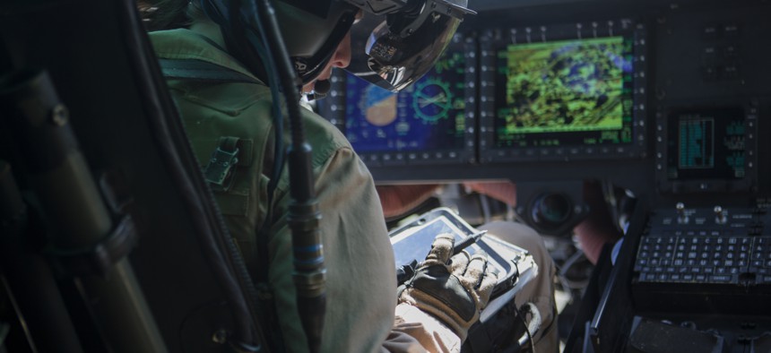 A U.S. Marine pilot uses a tablet during an urban close air support exercise in Yodaville, Ariz., Sept. 30, 2016.