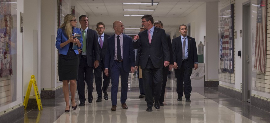 Secretary of Defense Ash Carter speaks with Jeff Bezos, Founder, Chairman & CEO of Amazon.com as they tour the Pentagon during a visit May 5 , 2016.