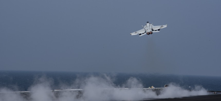 An F/A-18E Super Hornet assigned to the Gunslingers of Strike Fighter Squadron (VFA) 105 launches from the flight deck of the aircraft carrier USS Dwight D. Eisenhower (CVN 69).