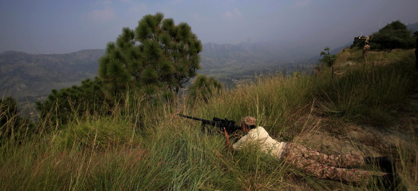 Pakistan army soldiers take position at a forward area Bagsar post on the Line of Control (LOC), that divides Kashmir between Pakistan and India, in Bhimber, some 103 miles, 166 km, from Islamabad, Pakistan, Oct. 1, 2016.