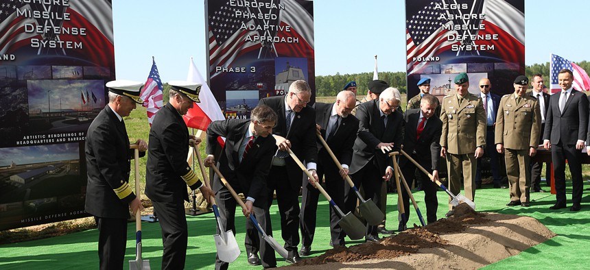 U.S. and Polish officials symbolically break ground for construction of the U.S.-led missile defense site in northern Poland in May.