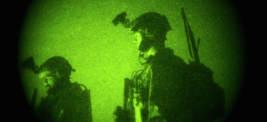Thursday, Oct. 29, 2009 file photo taken with a night vision scope, U.S. Special Operations forces engage in a joint operation with Afghan National Army soldiers.
