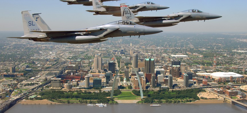 Four St. Louis-built F-15 Eagles fly past the city's downtown area in a 2008 photo.