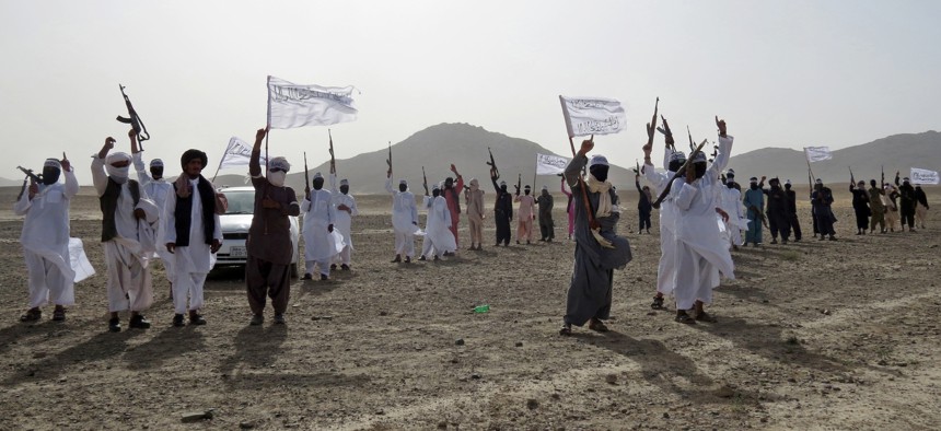Fighters from a breakaway Taliban faction known as Mahaaz-e-Dadullah attend a gathering in the southern Zabul province, Afghanistan, on Aug. 15, 2016.