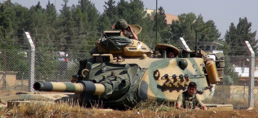 A Turkish army tank stationed near the Syrian border, in Suruc, Turkey, Saturday, Sept. 3, 2016. 