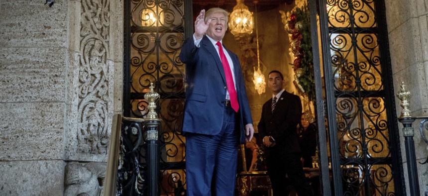 President-elect Donald Trump waves to members of the media after a meeting with admirals and generals from the Pentagon at Mar-a-Lago, in Palm Beach, Fla., on Wednesday, Dec. 21.
