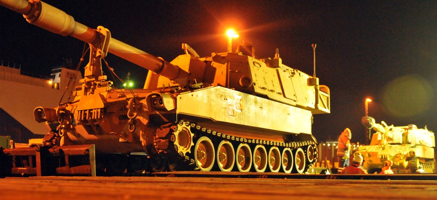 An Army M109A6 Paladin, sitting on a railhead in Germany Jan. 6, waiting to be transported to Poland.