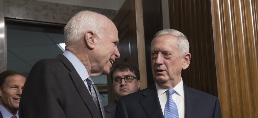 Senate Armed Services Committee Chairman Sen. John McCain, R-Ariz., left, welcomes Defense Secretary-designate James Mattis on Capitol Hill in Washington, Thursday, Jan. 12, 2017.
