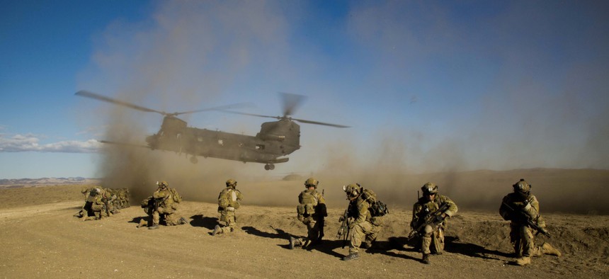 U.S. Army Rangers assigned to the 2nd Battalion, 75th Ranger Regiment prepare for extraction on a CH-47 Chinook helicopter aircraft during task force training at Camp Roberts, Calif., Feb. 1, 2014.