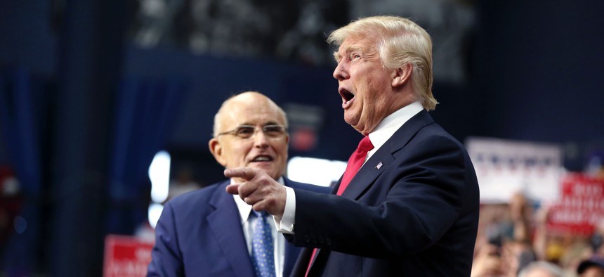 Then-Republican presidential candidate Donald Trump with his now-named cybersecurity advisor Rudy Giuliani at a campaign rally in Ohio in the summer of 2016.