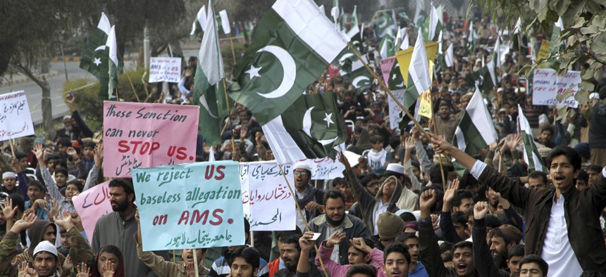 Supporters of Pakistani religious parties chant anti-American slogans during a rally in Lahore, Pakistan, Sunday, Jan. 8, 2017.