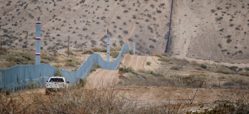 A U.S. Border Patrol agent drives near the U.S.-Mexico border fence in Sunland Park, N.M. in 2016.