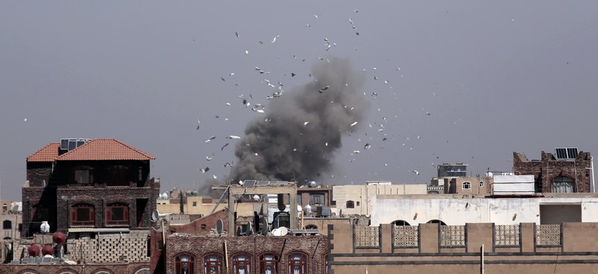 Debris and smoke rise after a Saudi-led airstrike hit an army base, in Sanaa, Yemen, on Jan. 22, 2017.