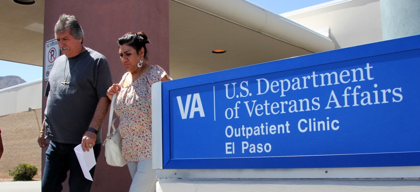 Patients exit the Vetarans Affairs facility in El Paso, Texas, June 9, 2014.