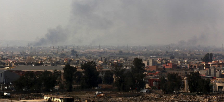 Smoke rises from the western side of Mosul following a U.S.-led coalition airstrike, in Mosul, Iraq, Monday, Jan. 30, 2017.