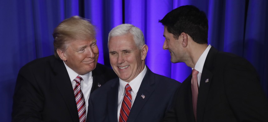 President Donald Trump, accompanied by Vice President Mike Pence, shakes hands with House Speaker Paul Ryan of Wis., Thursday, Jan. 26, 2017, prior to speaking at the Republican congressional retreat in Philadelphia. 