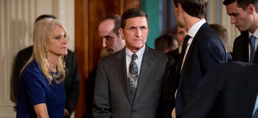 National Security Adviser Michael Flynn, center, arrives in the East Room of the White House in Washington, Monday, Feb. 13, 2017.