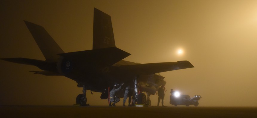 A U.S. Air Force weapons load crew assigned to the 33rd Aircraft Maintenance Squadron loads a live GBU-12 into an F-35A January 18, 2017, at Eglin Air Force Base, Florida. 