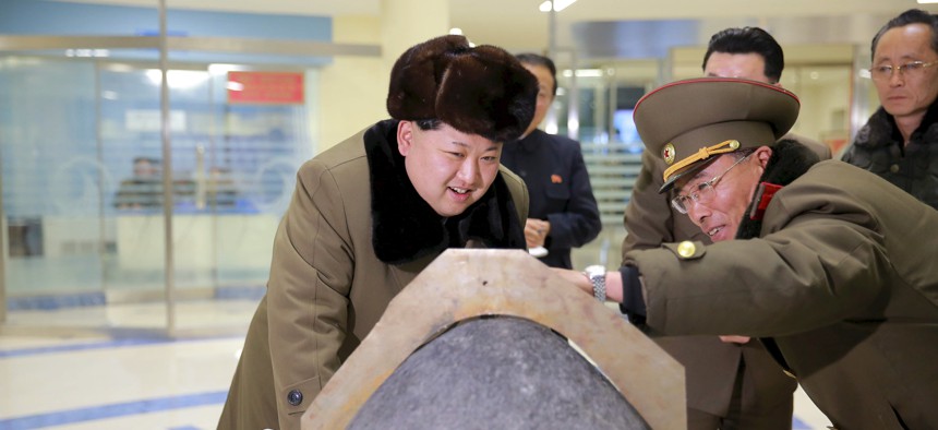 North Korean leader Kim Jong-Un looks at a warhead tip in this photo released by North Korea's Korean Central News Agency.