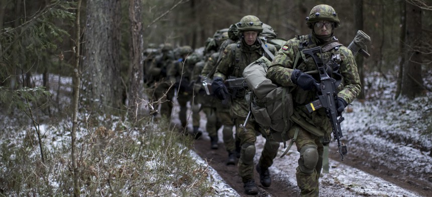 Lithuanian conscripts practice during a NATO military exercise, 'Iron Sword,' at the Rukla military base some 130 km. (80 miles) west of the capital Vilnius, Lithuania, Monday, Nov. 28, 2016.