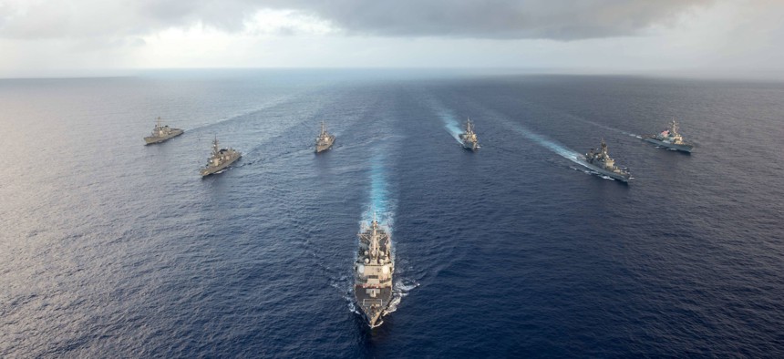 The Arleigh Burke-class guided-missile destroyer USS Mustin (DDG 89) leads U.S. Navy and Japanese ships in formation during MultiSail 17, March 10, 2017, in the Philippine Sea. 