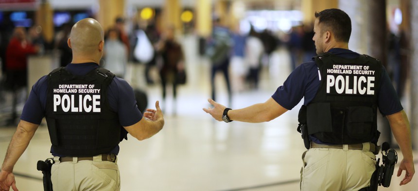 Department of Homeland Security police officers walk through Hartsfield–Jackson Atlanta International Airport ahead of the Thanksgiving holiday in 2015.