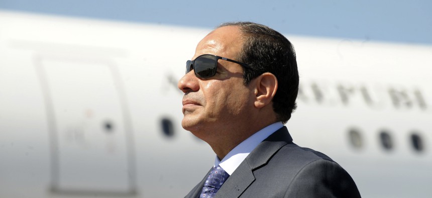 Egyptian President Abdel-Fattah el-Sissi stands at Algiers airport on his arrival to Algiers, Algeria, June 2014.