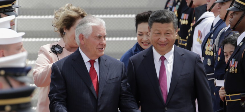 ecretary of State Rex Tillerson, left, walks with Chinese president Xi Jinping at the Palm Beach International Airport in West Palm Beach, Fla., Thursday, April 6, 2017. The president will meet with President Donald Trump for a two-day summit.