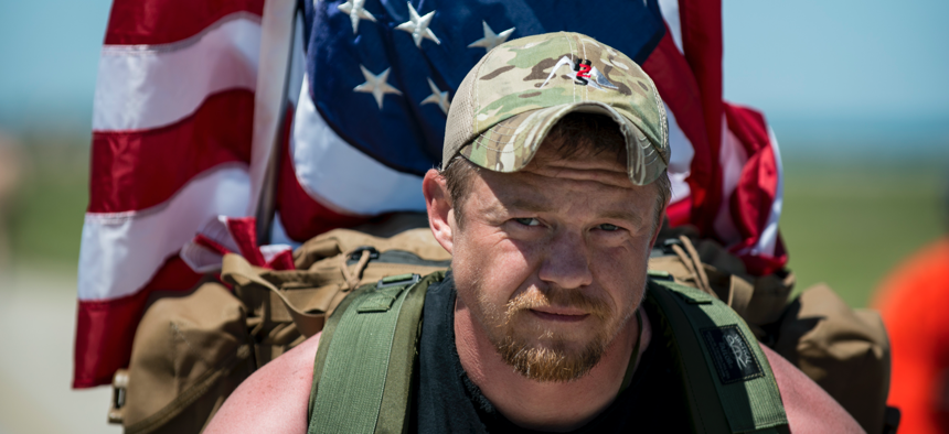 Army veteran Justin Vititoe marches in the Chicago Honor the Fallen Ruck March on May 22, 2015. 