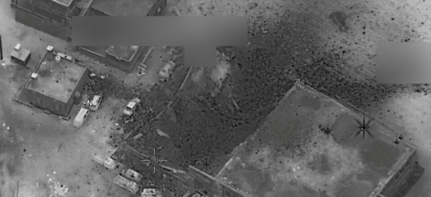 A photo of a March 16 airstrike by U.S. forces on a building that U.S. officials said was the scene of an al-Qaeda meeting.