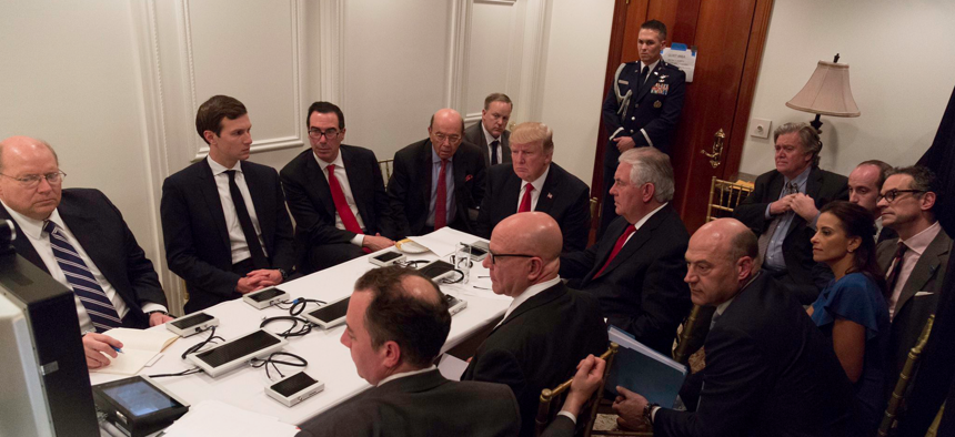 In Florida, President Donald Trump and members of his administration get a videoconferenced briefing about the April 7, 2017, cruise missile strike on Syria.