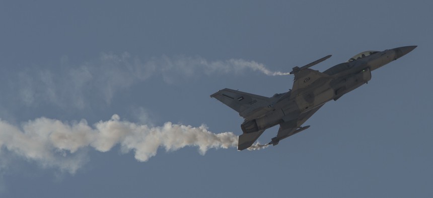 An F-16 Desert Falcon from the United Arab Emirates Air Force performs at the Bahrain International Airshow at Sakhir Airbase in Manama, Bahrain, Jan. 21, 2016.