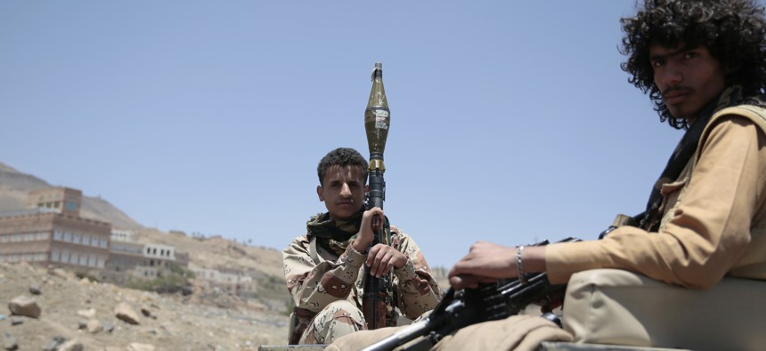 Shiite fighters, known as Houthis, secure a road from Sanaa to the port city of Hodeidah, Yemen, Wednesday, Apr. 19, 2017.
