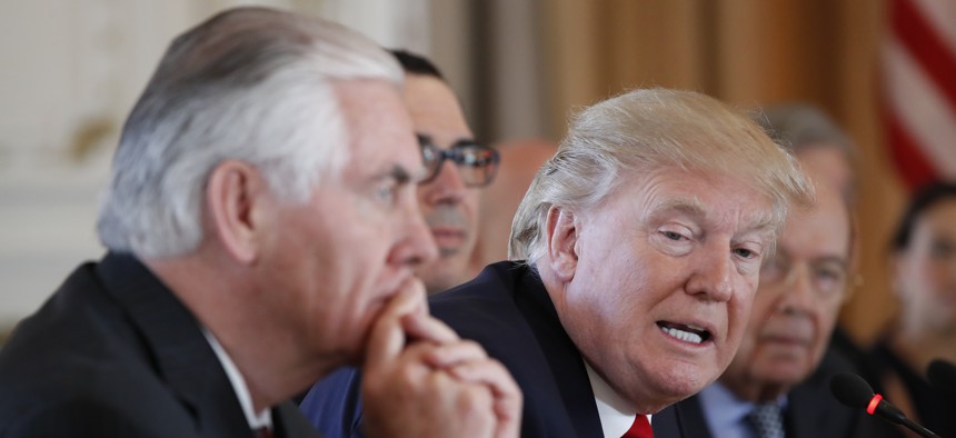 President Donald Trump, joined by Secretary of State Rex Tillerson, left, speaks during a bilateral meeting with Chinese President Xi Jinping at Mar-a-Lago, Friday, April 7, 2017, in Palm Beach, Fla. 