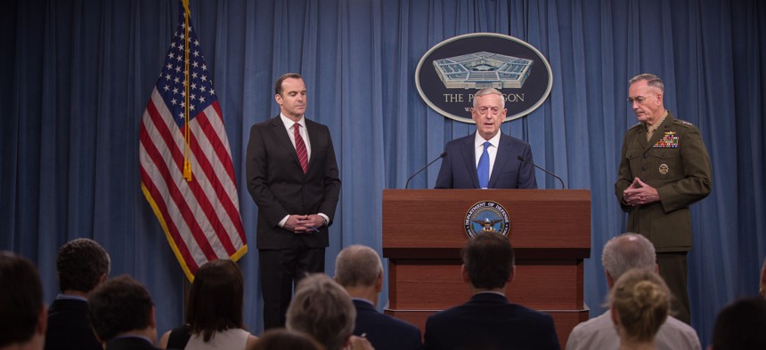 Defense Sec. Jim Mattis, center, details the first revised ISIS War plan of the Trump administration, with Joint Chiefs Chairman Gen. Joseph Dunford, and Special Envoy Brett McGurk, at the Pentagon, Fri., May 18, 2017.
