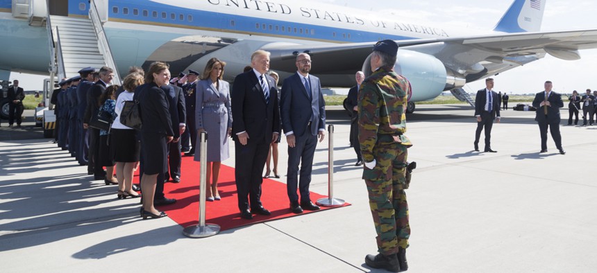 President Donald Trump and First Lady Melania Trump are welcomed by Belgium Prime Minister Charles Michel, and his wife, Amélie Derbaudrenghien, on their arrival to Brussels International Airport in Brussels, Belgium. 
