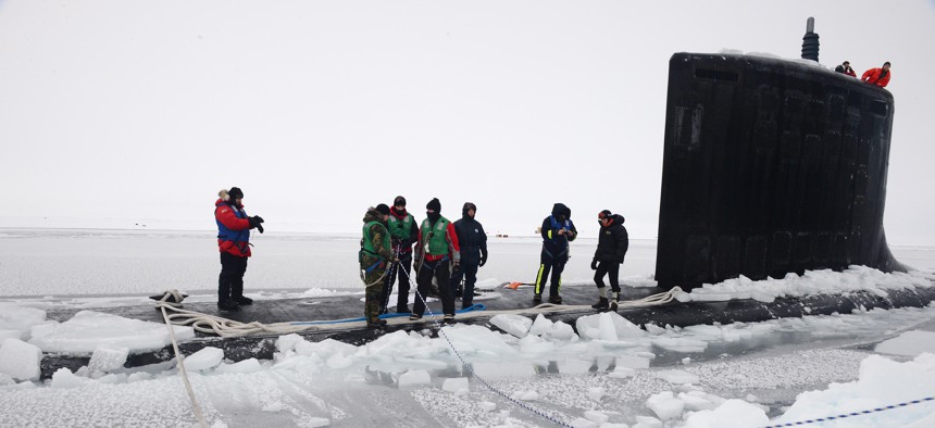 Sailors aboard USS New Mexico tie mooring lines after the submarine surfaced through the arctic ice at Ice Camp Nautilus, north of Alaska, in 2014.